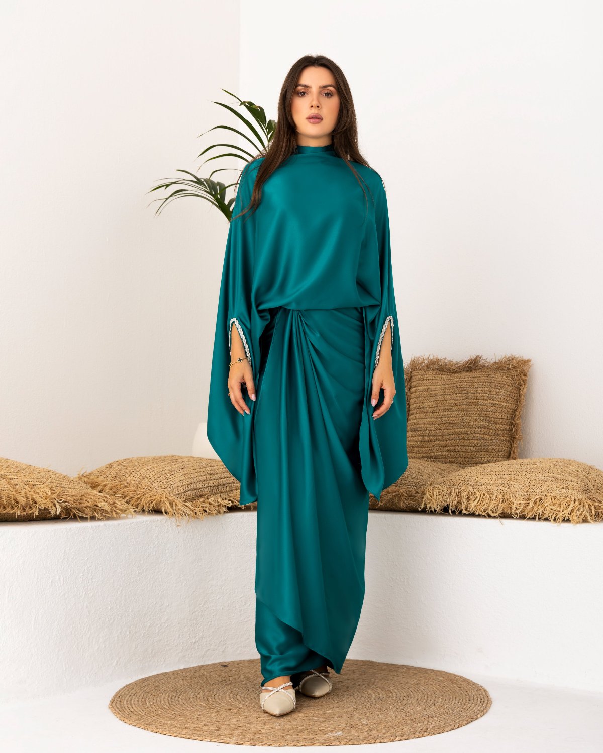 Teal satin modest outfit with long sleeves and a draped wrap skirt, styled for elegant and modest fashion.