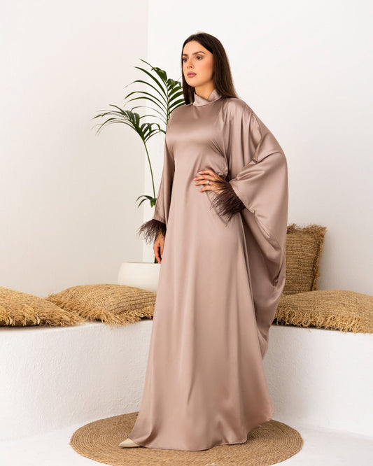 Khaki satin kaftan with feathered sleeves and free scarf.