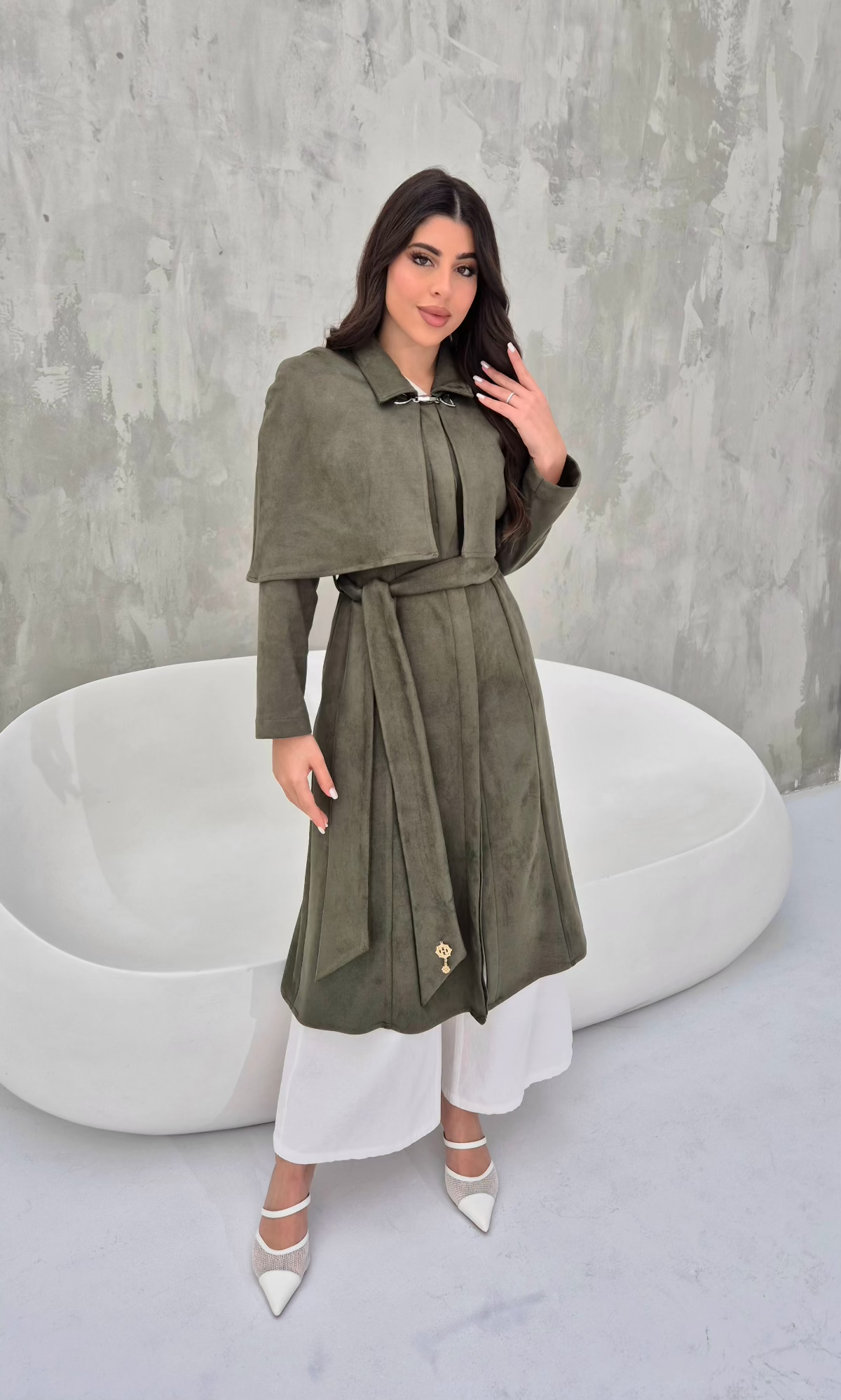 khaki suede cape coat, showcasing its flowy silhouette